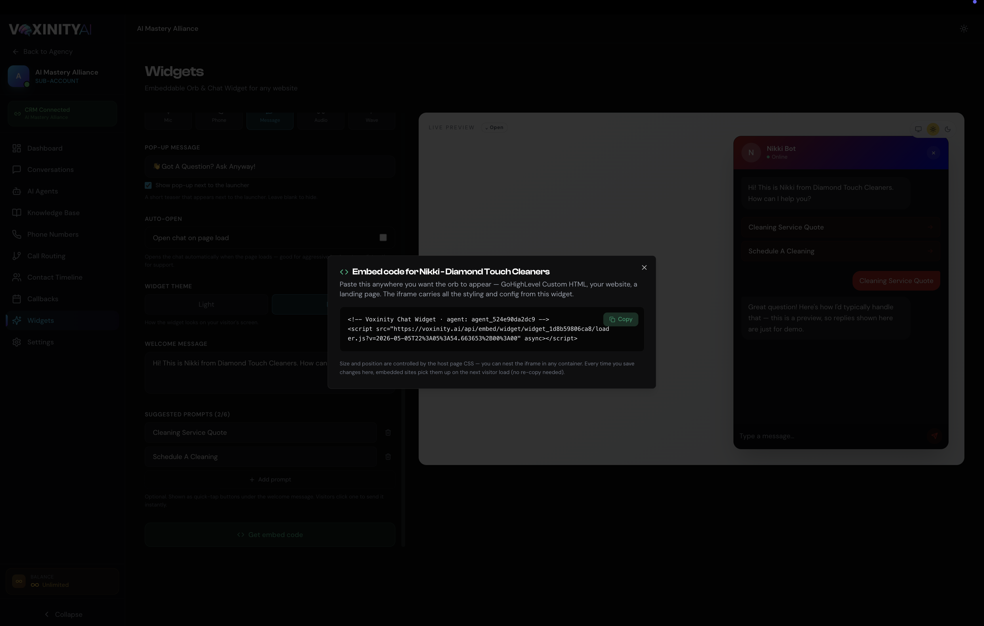 Embed code modal showing a one-line script tag — <script src="https://voxinity.ai/api/embed/widget/widget_xxx/loader.js" async></script> — with a Copy button